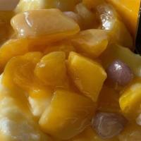 Mangonada Shaved Ice · Mango shaved ice topped with fresh mango and tajin clasico.