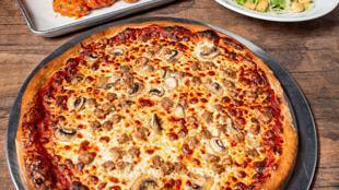 Combo #1 · Feeds approximately three to four. One large one-two topping pizza, six wings and family salad (house or Caesar). Extra topping for an additional charge.