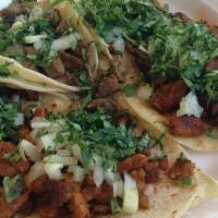 Two Beef Tacos · Two corn hard shell tacos filled with shredded beef, lettuce and cheese. Includes rice and b...