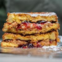 Pb+J Cornflake French Toast · classic pb+j sandwich with grape jelly, dipped in french toast batter, crusted in cornflakes...