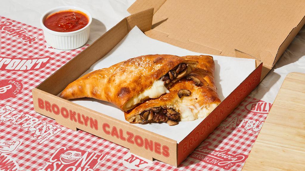 Red Hook Calzone · Calzone with savory sausage, mushroom, melted parmesan and mozzarella, and a side of marinara.