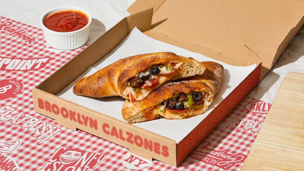 Coney Island Calzone · Calzone with pepperoni, sausage, peppers, olives, onions, melted mozzarella and a side of marinara.