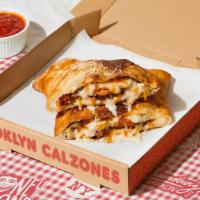 Flatbush Calzone · Calzone with juicy BBQ chicken, onion, melted mozzarella, and a side of marinara.