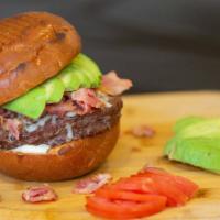 House Burger · 8 oz. house-ground beef patty, brioche bun, avocado, bacon, mozzarella cheese, aji aioli, bu...