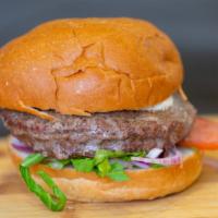 Classic Burger · 8 oz. house-ground beef patty, brioche bun, garlic aioli, lettuce, onions, tomatoes, burger ...