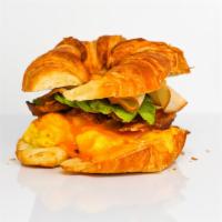 Croissant, Bacon, Turkey, Avocado, Egg, & Cheddar Sandwich · 2 scrambled eggs, melted Cheddar cheese, crispy bacon, sliced smoked turkey, avocado, and Sr...