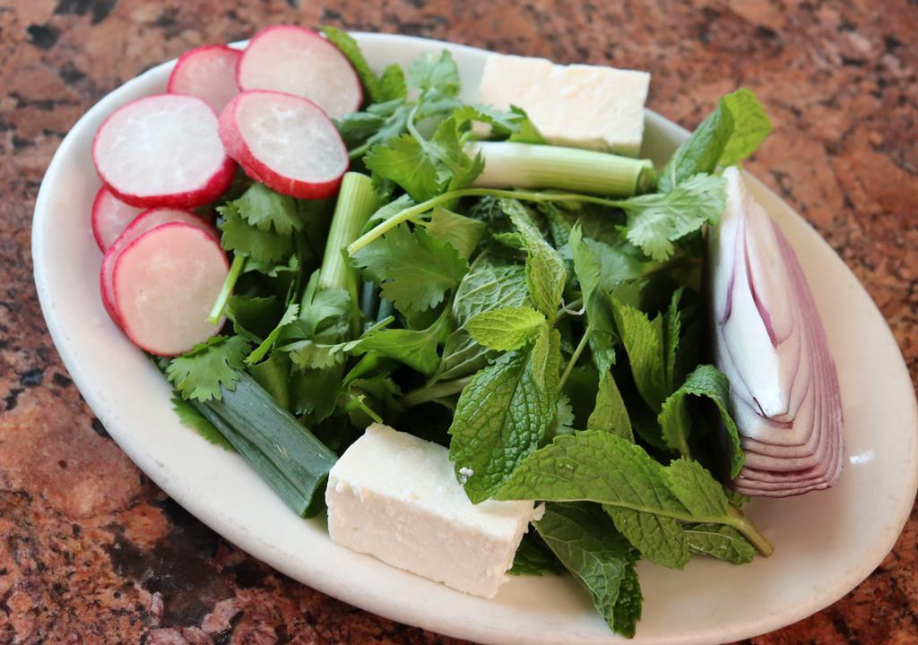 Sabzee Khordan · Medeley of fresh herbs, feta cheese, onion, walnuts, and radishes - served with naan