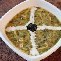 Ash Reshteh (Soup) · Noodle soup – fresh herbs, lentils, garbanzo and kidney beans drizzled with kashk, carameliz...