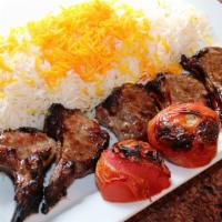 Shish Leek · Lamb chops served with basmati rice and grilled tomato
