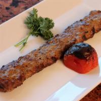 Shami · Seasoned ground beef, broiled on skewers over charcoal.