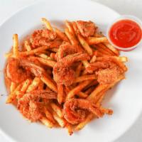 Crab Shack Shrimp With Fries · Shrimp deep fried until golden brown, tossed with our signature cajun seasoning and topped w...