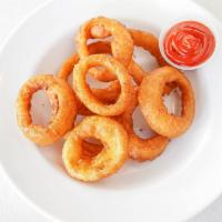 Onion Rings · 8 onion rings lightly covered in beer batter and deep fried to a crisp, served with a side o...