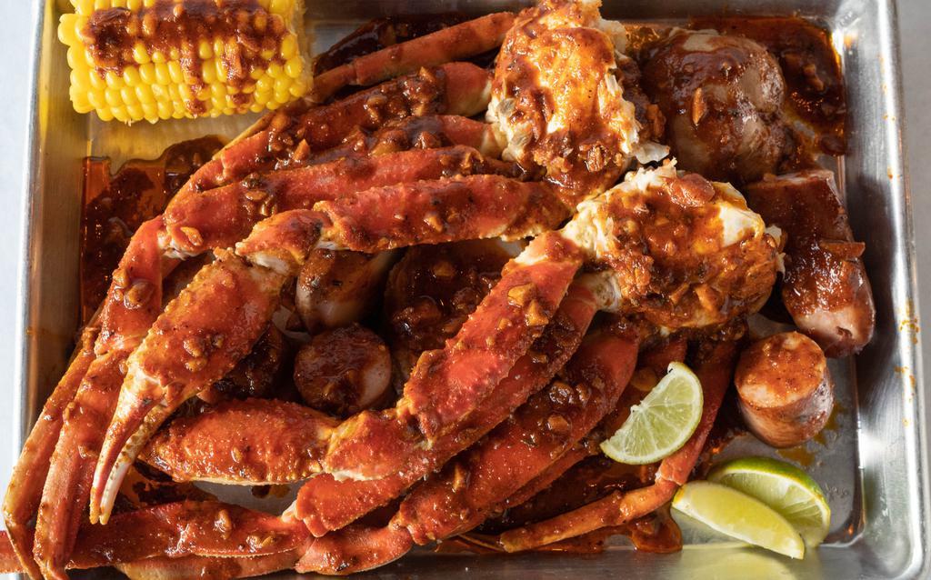 Snow Crab Legs · 2 clusters of easy-to-crack Snow Crab legs filled with juicy crab meat, covered with your choice of seasoning and spice level. 

note: 1 Corn and 2 pcs of Sausage is included. 

Price per LB.