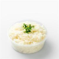 Steamed White Rice · A serving of steamed white rice.