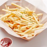 French Fries · Shoestring French fries served with a side of ketchup.