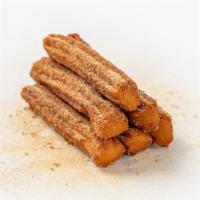 Sugar Daddy Churros · Crispy churro donuts spiced with cinnamon sugar to perfection!