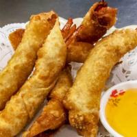 Shrimp Rolls (6 Pcs.) · Deep fried shrimp wrapped with egg roll skin.