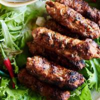#28. Seekh Kebab · Mildly spiced minced lamb skewered & grilled over charcoal.
