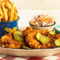 Nashville Hot Chicken Dinner · Buttermilk-soaked, then breaded and fried crispy and tossed in fiery Nashville hot sauce. Se...