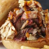 Lucille'S Original Pulled Pork Sandwich · Our special pork roast, slow-smoked until it's fork-tender, hand shredded and tossed in our ...