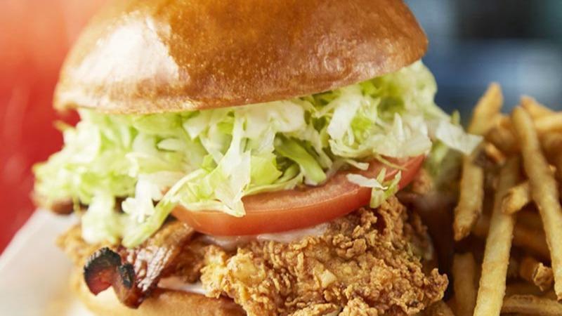 Southern Fried Chicken Sandwich · Fried chicken breast, applewood bacon, jack cheese, vine-ripened tomato and lettuce with ranch dressing on a soft brioche bun.