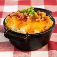 Loaded Mashed Potatoes · Lucille’s own garlic mashed potatoes topped with butter, sour cream, cheddar cheese, chopped...