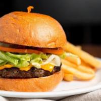 Classic Cheese Burger · ½ lb. ground beef patty melted natural Cheddar cheese, lettuce, tomato and pickle chips on a...