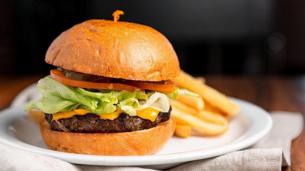 Classic Cheese Burger · ½ lb. ground beef patty melted natural Cheddar cheese, lettuce, tomato and pickle chips on a warm Brioche bun. Served with 1000 island dressing.