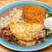 Chicken Or Steak Omelette · Includes bell peppers, onions, tomato, and sour cream, topped with ranchera sauce, monterey ...