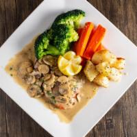 Salmone Di Alaska · Grilled salmon with roasted garlic mushroom cream sauce. Served with vegetables and potatoes.