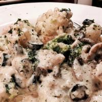 Chicken Artichoke And Spinach Ravioli · Sautéed diced chicken, artichoke, mushroom, olives, in a creamy sauce paired with spinach ra...