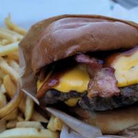 Double Western Bacon Cheeseburger · Double meat, Double Cheese
two slices of bacon. onion rings 
between brioche bun smothered w...