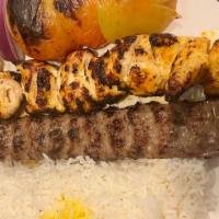 Combination Plate · One Skewer of Boneless Chicken & One Skewer of Koobideh Kabobs! Served with Charbroiled Toma...