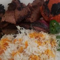 Gyro Plate · Gyro meat skewers served salad and basmati rice and comes with tzatziki.