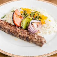 Koobideh Kabob · Juicy, charbroiled seasoned ground beef served with a charbroiled tomato and basmati rice to...