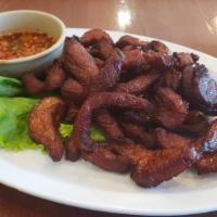 Pork Jerky · Deep fried marinated pork with house made spicy sauce
