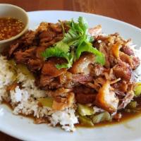 Stew Pork Leg Over Rice · Stew pork leg served with Chinese pickled vegetable over rice and side of spicy sour chili s...