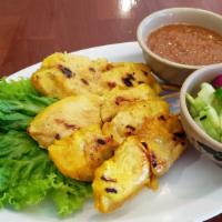 Chicken Sate · Skewered grilled chicken served with peanut sauce and cucumber sauce.