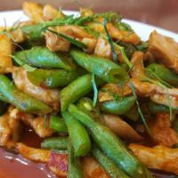 Pad Prik King · Choice of protein sauteed with green bean, in-house red curry paste and lime leaves.