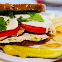 Pesto Chicken Sandwich · Wheat toast bread, chicken breast, pesto sauce, fresh Mozzarella, tomato, fresh basil