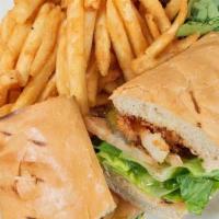 Shrimp Po'Boy Sandwich · SERVED ON A BUTTER TOAST HOAGIE ROLL WITH LETTUCE, TOMATO, PICKLE, CAJUN REMOULADE SAUCE AND...