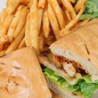 Catfish Po'Boy · SERVED ON A BUTTER TOAST HOAGIE ROLL WITH LETTUCE, TOMATO, PICKLE, CAJUN REMOULADE SAUCE AND...