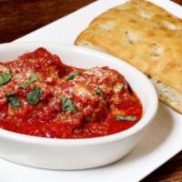 Patxi'S Meatballs · Homemade meatballs braised with tomato sauce, parmesan, basil, in a bread bowl.