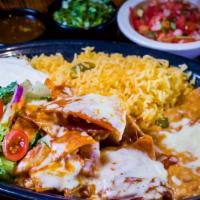 Chilaquiles · Crunchy chips, simmered in red or green salsa with melted cheese. Served with rice, beans, s...