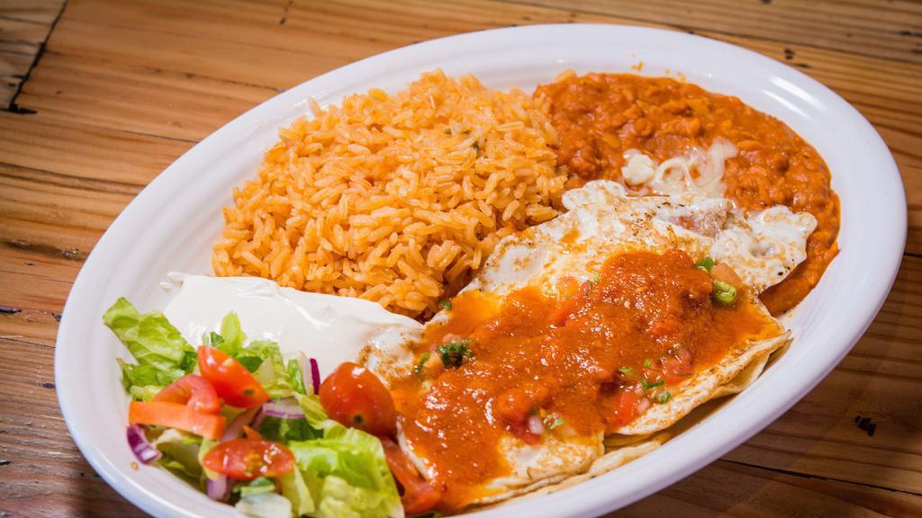 Huevos Rancheros · Fried eggs served on corn tortillas and smothered in cooked salsa.