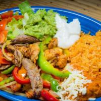 Fajitas Pollo O Res · Chicken or beef fajitas. Includes rice, beans, sour cream, guacamole, lettuce, tomatoes and ...