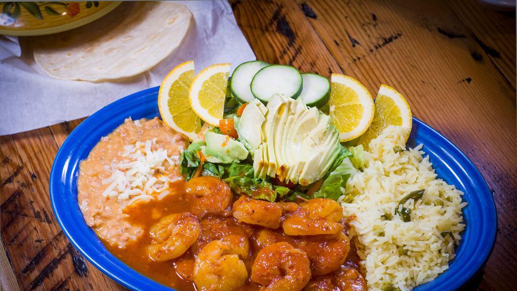 Camarones A La Diabla · Spicy prawns. Includes rice, beans, cucumber, avocado, lettuce, tomatoes and tortillas.