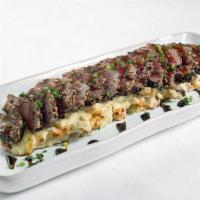 Filet Mignon Sashimi · Filet Mignon crusted with white and black sesame seeds, seared rare, and served over wasabi ...