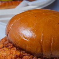 Home Sandwich · Buttermilk fried chicken smothered with East-African clarified butter, herbed mayo, and toma...