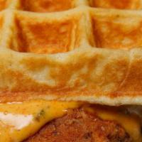 Chick-In-Waffle Sandwich Combo · Buttermilk fried chicken smothered in Thai chili oil, honey mustard, and stuffed in our butt...